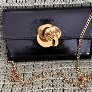 Ted Baker Glossy Black Clutch with Gold Floral Accent